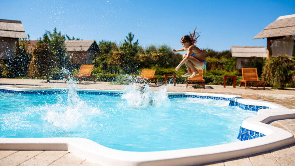 Professional swimming pool contractor in Dubai constructing a luxury pool in a backyard